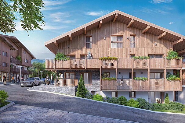 Modern wooden chalet-style apartments with plant-filled balconies next to a paved road with pedestrians.