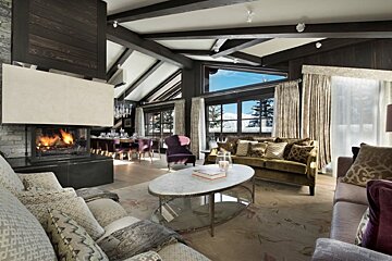 A living room with a fireplace and a couch