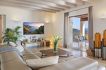 A living room with a couch and a flat screen tv