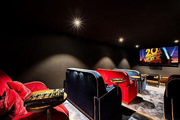 A movie theater with a screen that says 20th century fox