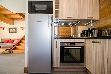 A kitchen with a refrigerator that says liebherr on it