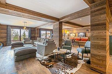 A living room with a cowhide rug on the floor