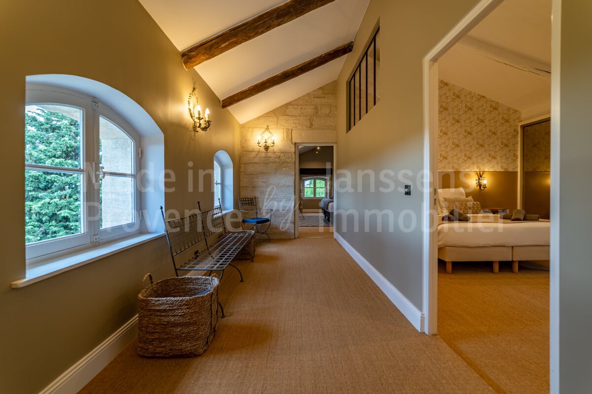 A hallway leading to a bedroom with the word lanson on the wall