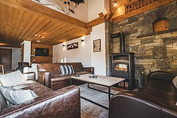 A living room with a fireplace and a couch