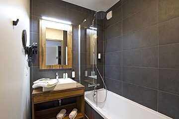 A bathroom with a sink and a bathtub