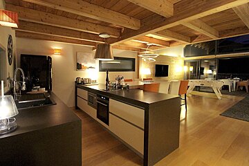 A kitchen with a large island in the middle of it