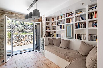 A bookshelf with a book titled ' a brief history of the world ' on it
