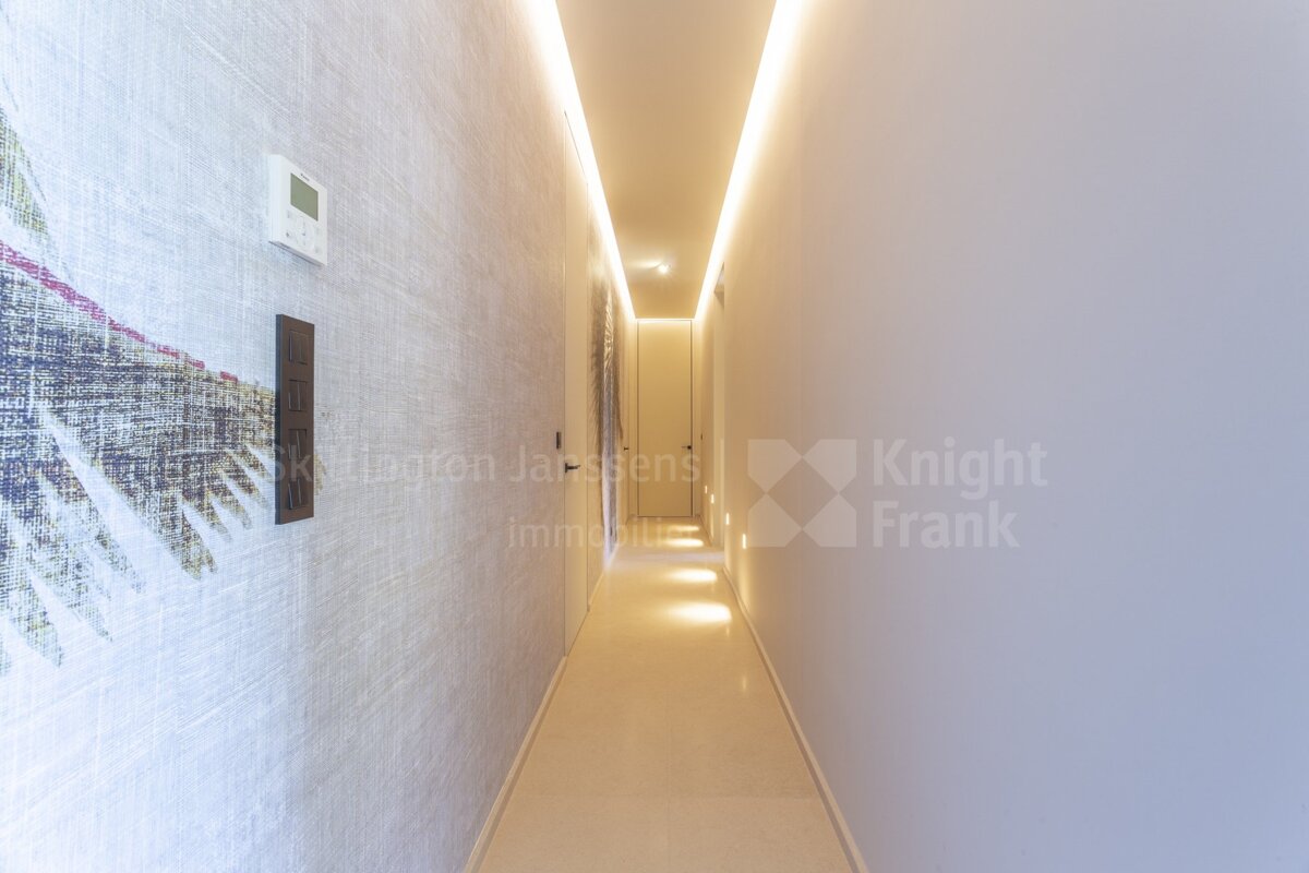 A hallway with knight frank written on the wall