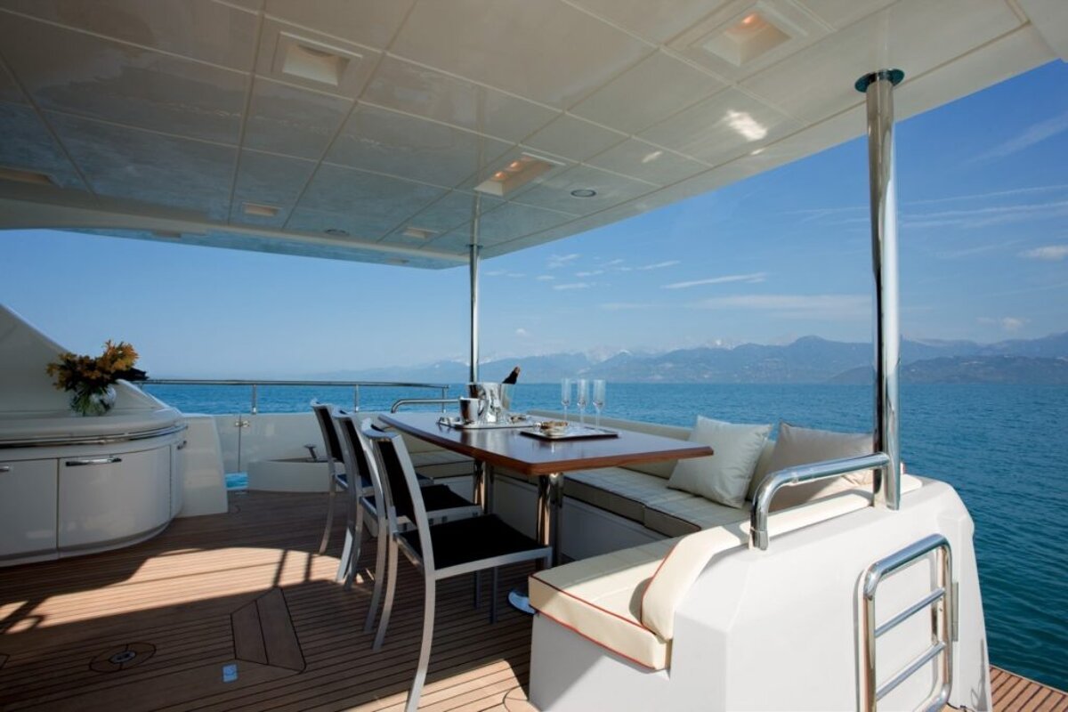 A boat with a table and chairs in the water