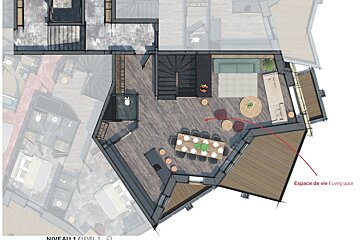 A floor plan of a house with a red arrow pointing to espace de vie