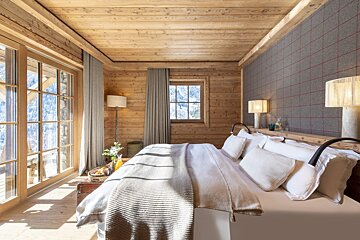 A bedroom with a bed and a large window