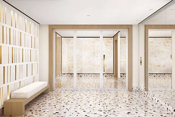 A hallway with a bench and a large mirror