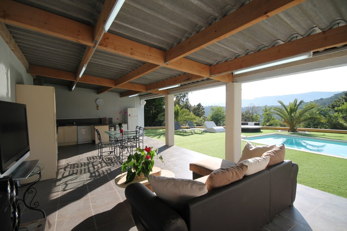 A living room with a couch and a flat screen tv