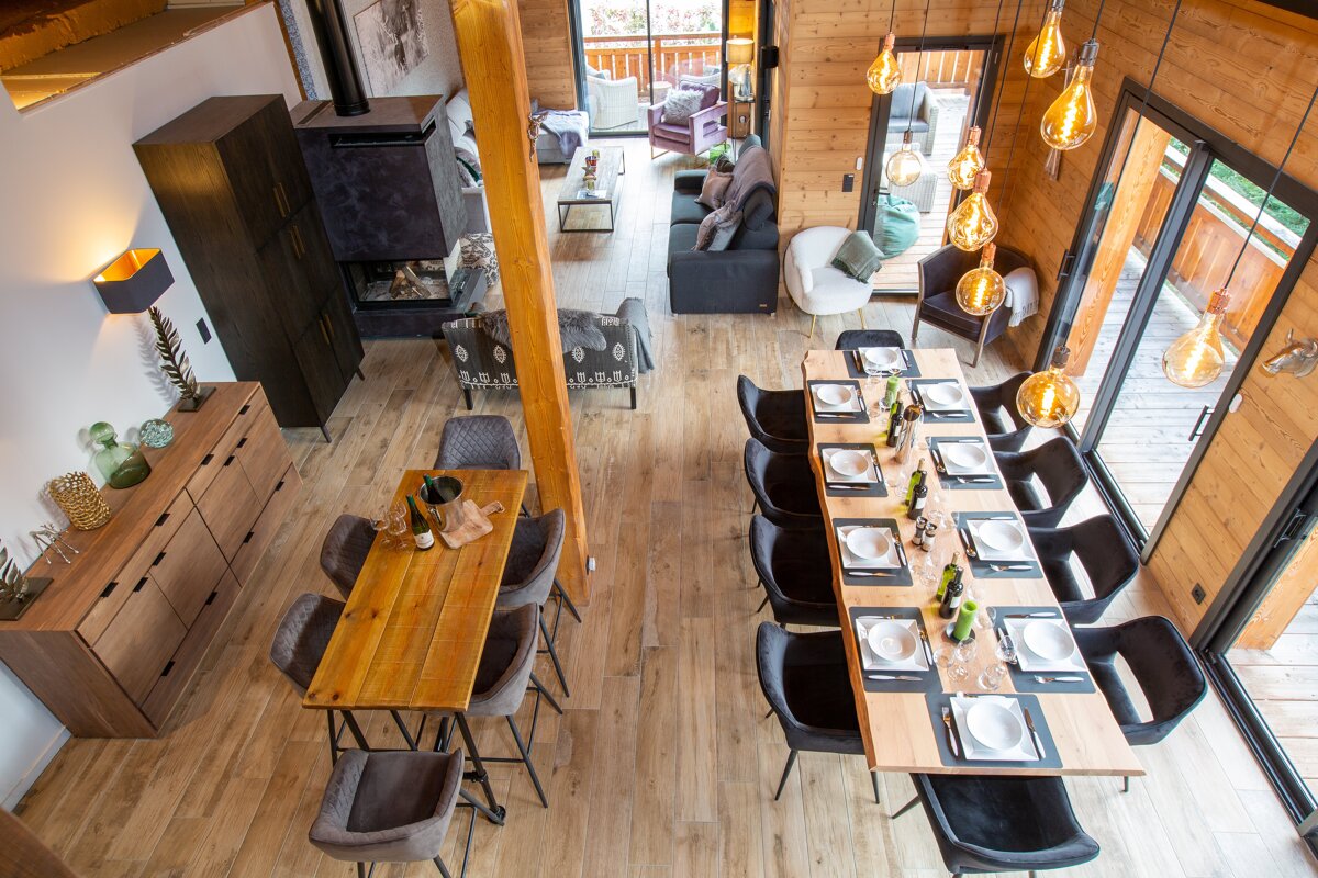 An aerial view of a dining room and living room
