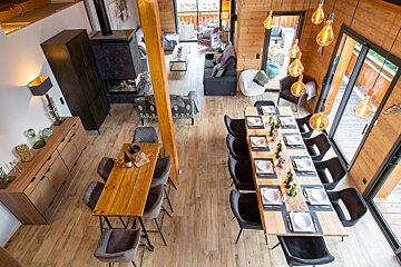 An aerial view of a dining room and living room