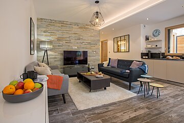 A living room with a couch and a flat screen tv