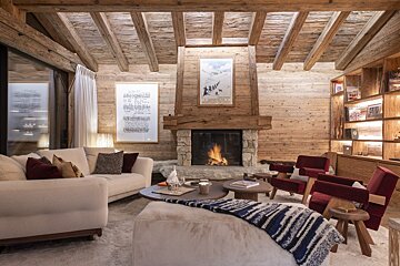 A living room with a fireplace and a couch