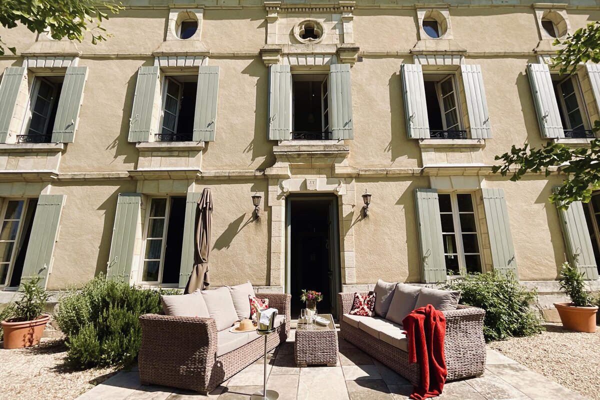 A large building with a lot of windows and shutters