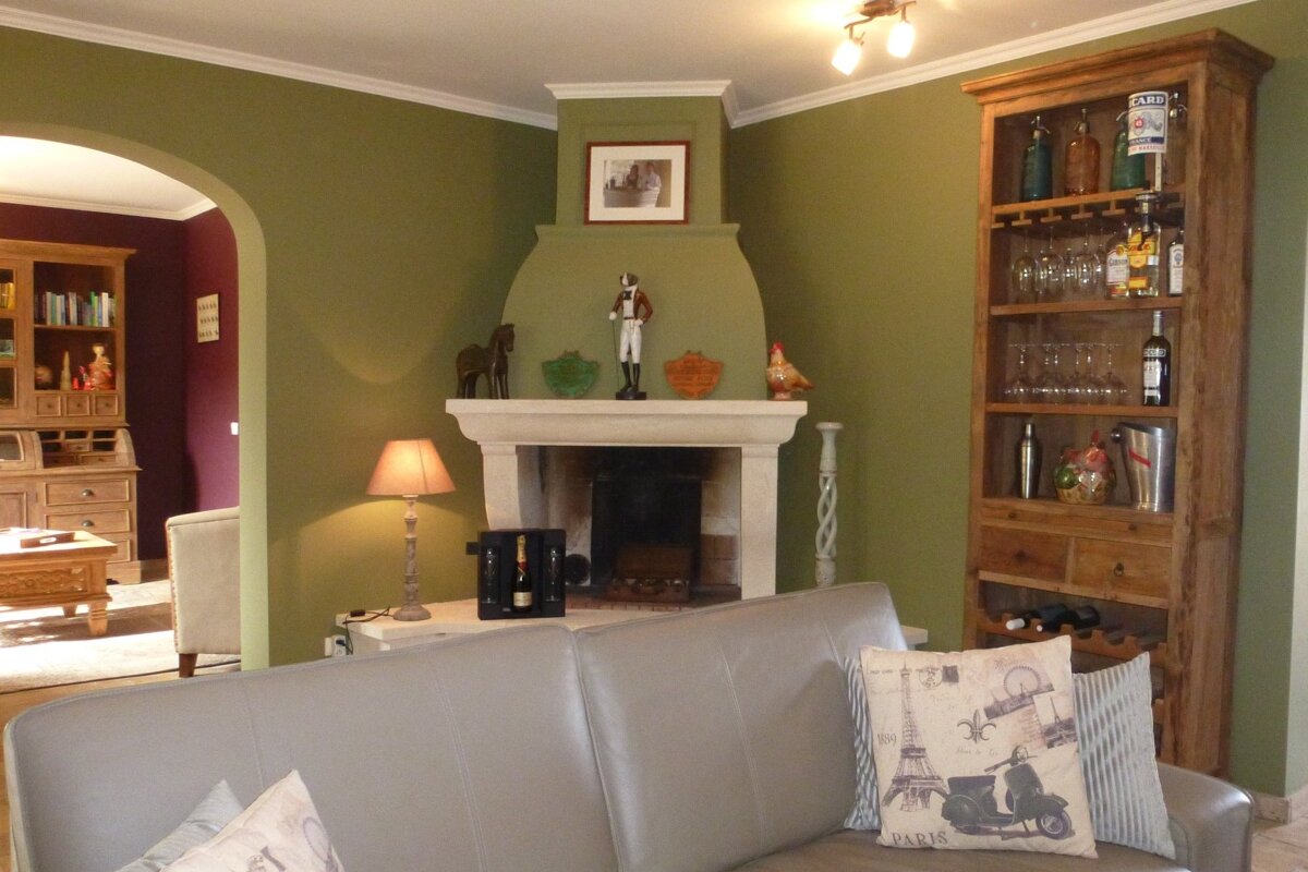 A couch with a paris pillow on it