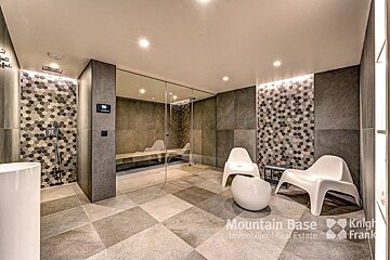 A bathroom with a sign that says mountain base