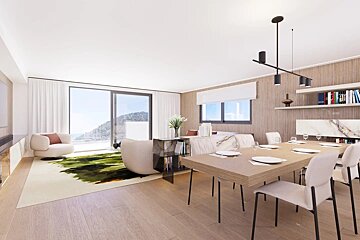 A spacious, modern open-plan living and dining area with light wood accents and a view of hills through large windows.