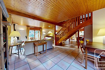 A wooden staircase leading up to the second floor of a house