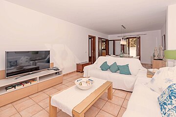 A living room with a couch and a flat screen tv