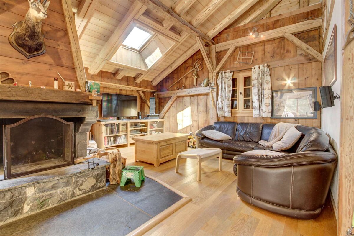 A living room with a fireplace and a couch