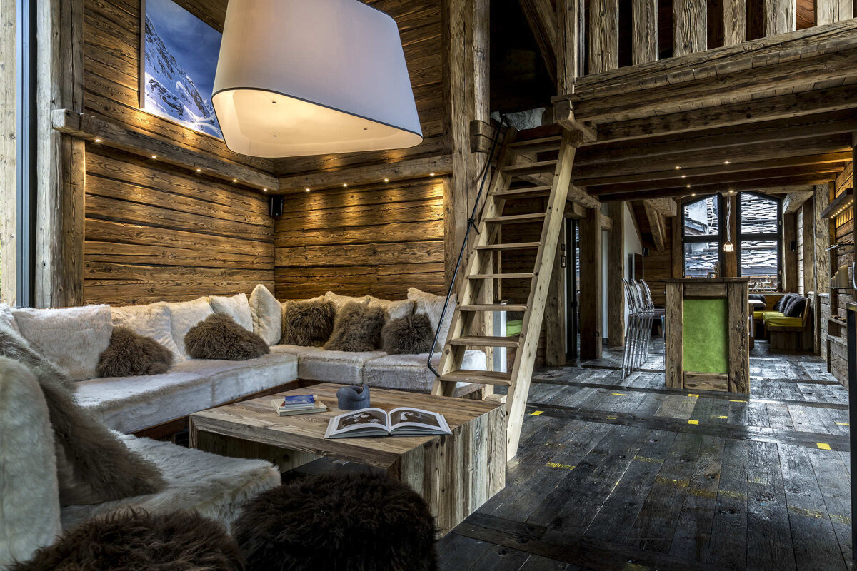 A wooden table with a vase of flowers on it