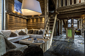 A wooden table with a vase of flowers on it