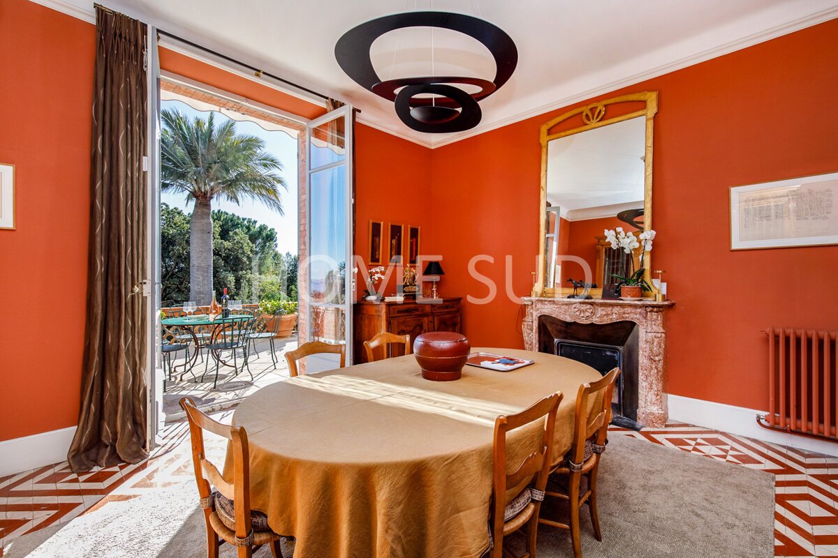 A dining room with a table and chairs and a sign that says love sud
