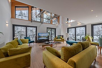 A living room filled with furniture and a flat screen tv