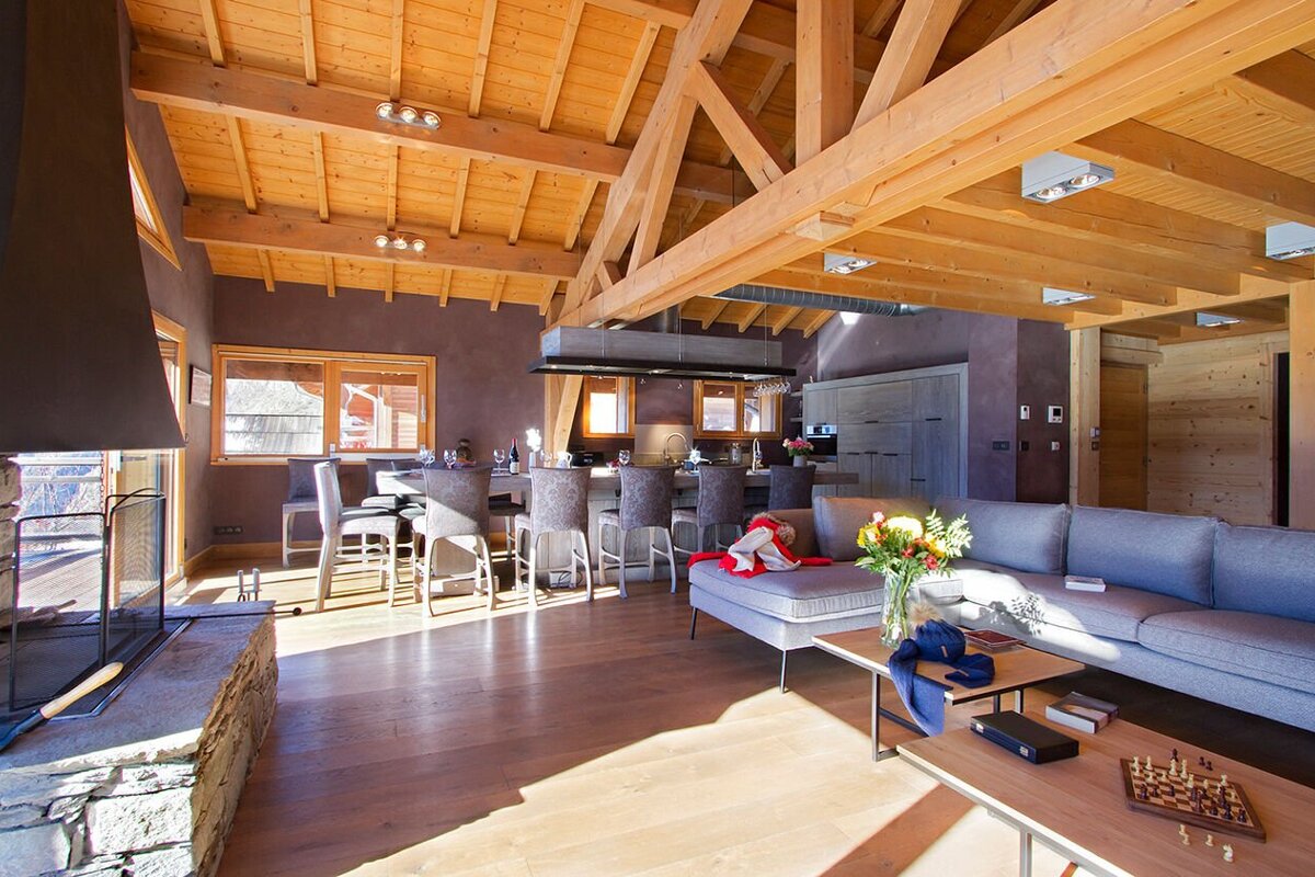 A living room with a couch and a chess board
