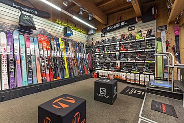 A salomon cube sits in the middle of a ski shop