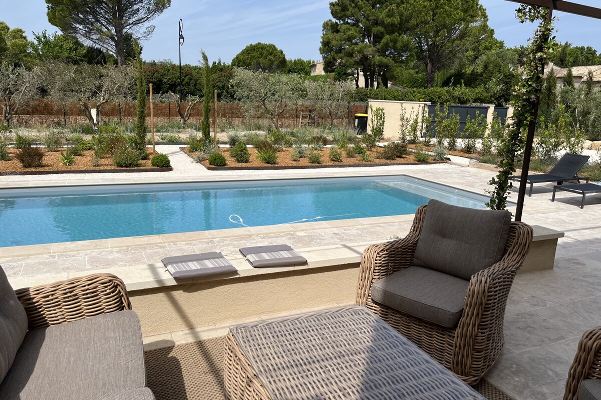 A view of a swimming pool from a patio area