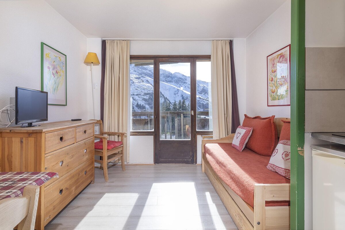 A living room with a couch and a television