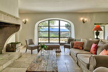 A living room with a couch and chairs made in provence
