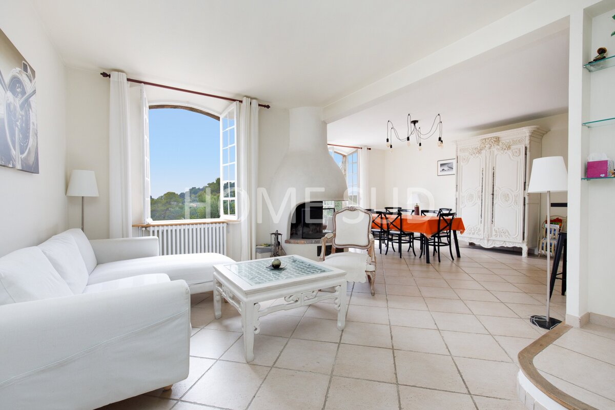 A living room with the word home on the wall