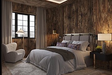 A bedroom with a large bed and a chair