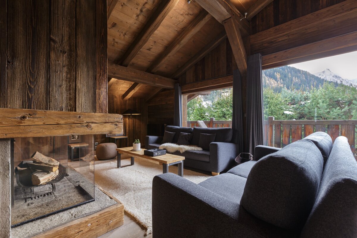 A living room with a fireplace and a couch