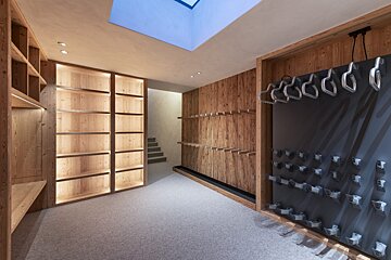 A room with wooden shelves and a ceiling light