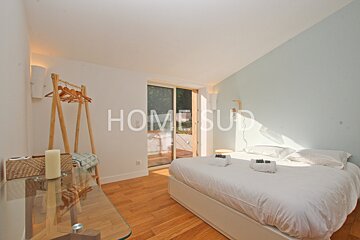 A bedroom with the word home on the wall