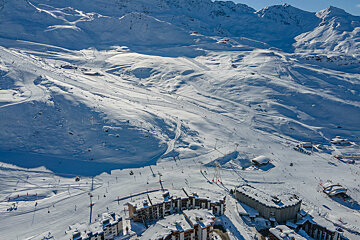 An aerial view of a ski resort with a building that has the letter o on it