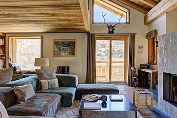 A living room with a couch and a table