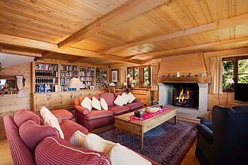 A living room filled with furniture and a fireplace