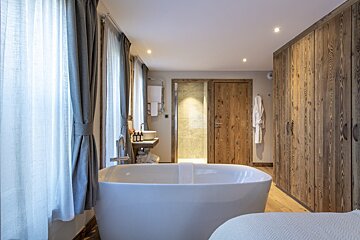 A bathroom with a bathtub and a sink