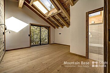 A room with a skylight and a sign that says mountain base