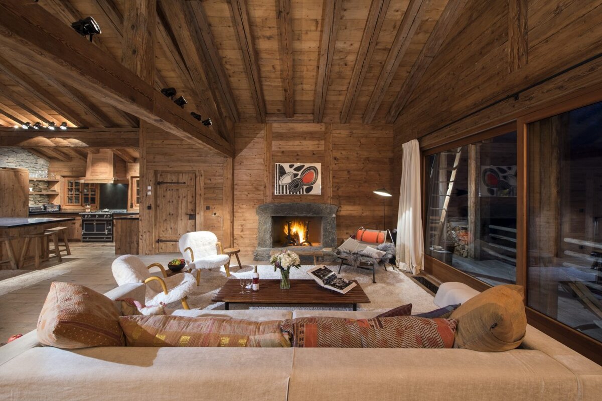 A living room with a fireplace and a couch