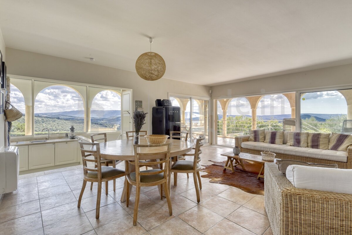 A living room with a table and chairs and a couch
