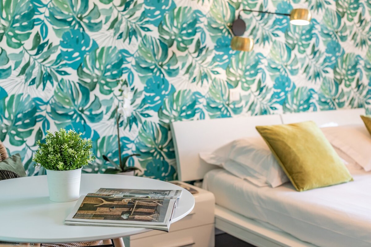 A table with a magazine and a potted plant on it